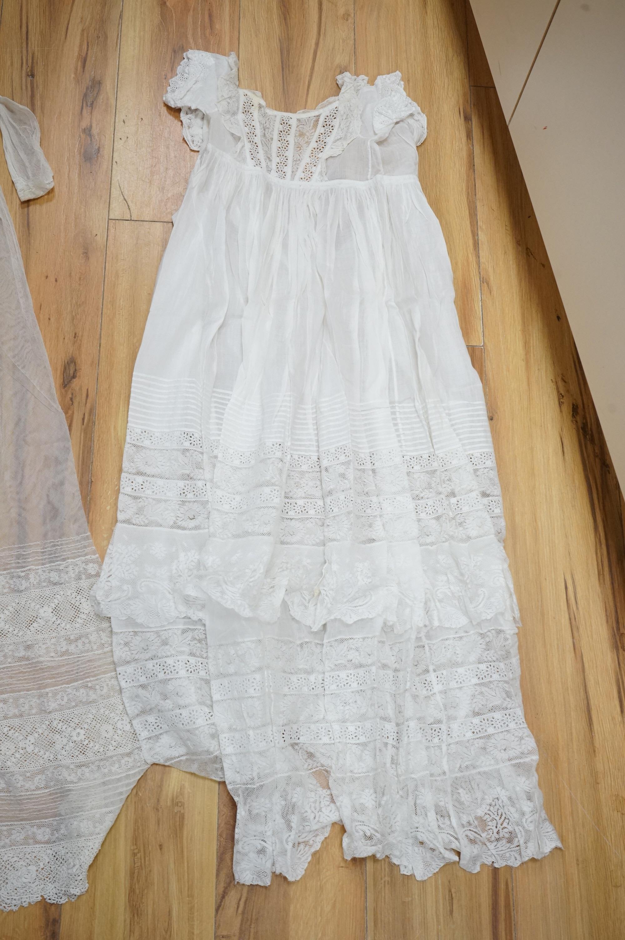 A collection Victorian textiles to include a lace christening gown, Irish crochet and a net baby gown